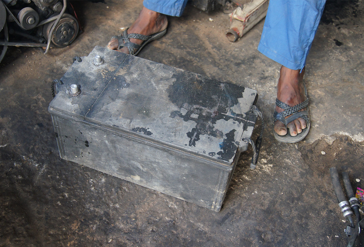 A car battery at a mechanic shop in Ngagne Diaw